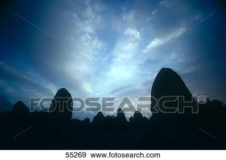 Stock Photo - Silhouette of menhir stones at dusk, Carnac, Brittany, France . Fotosearch