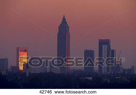 Skyscrapers in city at dawn, Frankfurt, Germany View Large Photo Image Stock Photograph - Skyscrapers in city at dawn, Frankfurt, Germany . Fotosearch