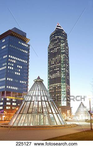 Skyscrapers lit up in city, Messeturm Tower, Frankfurt, Hesse, Germany View Large Photo Image Stock Photo - Skyscrapers lit up in city, Messeturm Tower, Frankfurt, Hesse, Germany . Fotosearch