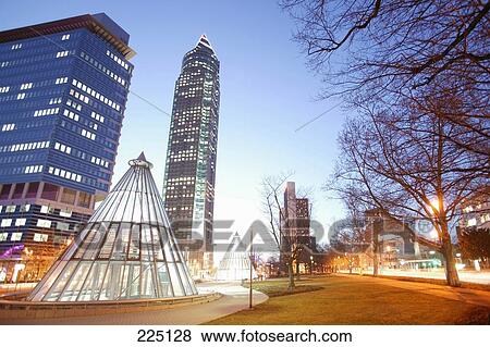 Skyscrapers lit up in city, Messeturm Tower, Frankfurt, Hesse, Germany View Large Photo Image Stock Photo - Skyscrapers lit up in city, Messeturm Tower, Frankfurt, Hesse, Germany . Fotosearch
