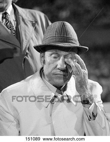 Soccer coach rubbing his eye in stadium, Germany View Large Photo Image Stock Photo - Soccer coach rubbing his eye in stadium, Germany . Fotosearch
