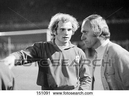 Soccer player talking to coach at soccer field  View Large Photo Image Stock Image - Soccer player talking to coach at soccer field . Fotosearch