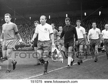Stock Photography - Soccer players walking in stadium, Hamburg, Germany . Fotosearch