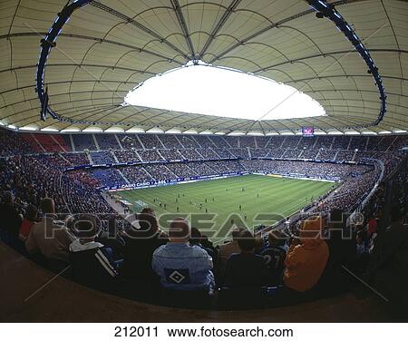 Stock Image - Spectators in soccer stadium, Aol Arena, Hamburg, Germany . Fotosearch