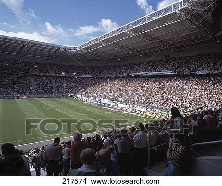 Picture - Spectators in soccer stadium, Borussia Park, Monchengladbach, North Rhine-Westphalia, Germany . Fotosearch