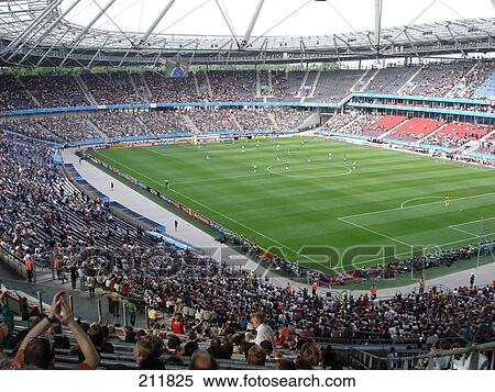 Stock Photography - Spectators looking at football match in stadium, AWD Stadium, Hannover, Lower Saxony, Germany . Fotosearch
