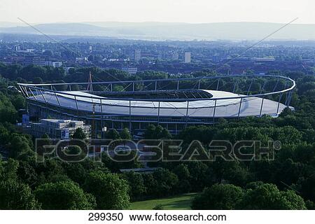 Stock Image - Sports stadium surrounded by trees, Hannover, Lower Saxony, Germany . Fotosearch