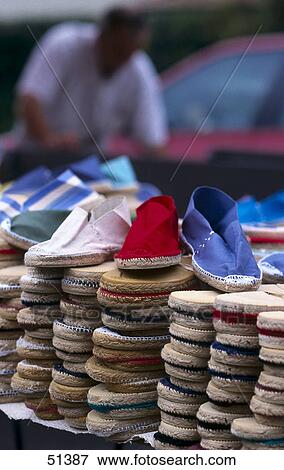 Stack of shoes at market stall, Capbreton, France View Large Photo Image Stock Photo - Stack of shoes at market stall, Capbreton, France . Fotosearch