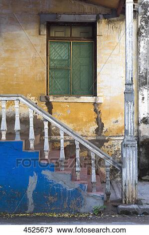 Stairs and window of an old colonial building in Quelimane, Mozambique  View Large Photo Image Stock Image - Stairs and window of an old colonial building in Quelimane, Mozambique . Fotosearch