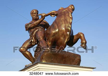 Statue of Heracles sitting on a bull, Schwerin, Germany, low angle view View Large Photo Image Stock Photo - Statue of Heracles sitting on a bull, Schwerin, Germany, low angle view . Fotosearch