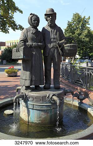 Stock Image - Statues on a fountain, Quakenbrueck, Germany . Fotosearch
