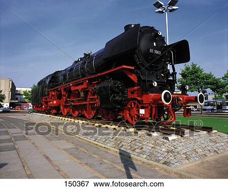 Stock Photo - Steam engine on track in museum . Fotosearch