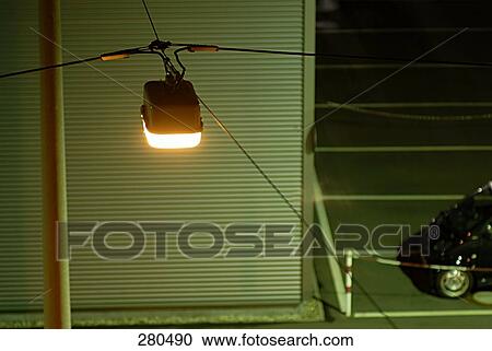Stock Image - Street light lit up at night . Fotosearch