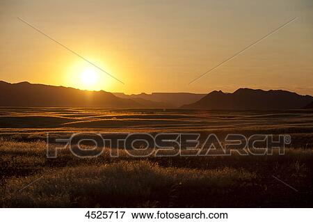 Stock Photo - Sunset at Sesriem in Naukluft Park, Namib Desert, Namibia . Fotosearch