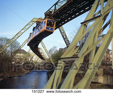 Suspension monorail over bridge, Wuppertal Schwebebahn, River Wupper, Wuppertal, North Rhine-Westphalia, Germany View Large Photo Image Stock Photo - Suspension monorail over bridge, Wuppertal Schwebebahn, River Wupper, Wuppertal, North Rhine-Westphalia, Germany . Fotosearch