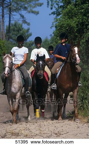 Teenage girls riding horse View Large Photo Image Stock Photography - Teenage girls riding horse . Fotosearch