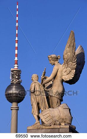 Stock Image - Television tower and bridge statue against blue sky, Berlin, Germany . Fotosearch