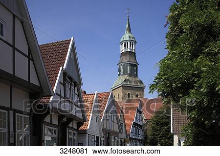 Timber-framed houses and church spire, Quakenbrueck, Germany, low angle view View Large Photo Image Stock Image - Timber-framed houses and church spire, Quakenbrueck, Germany, low angle view . Fotosearch