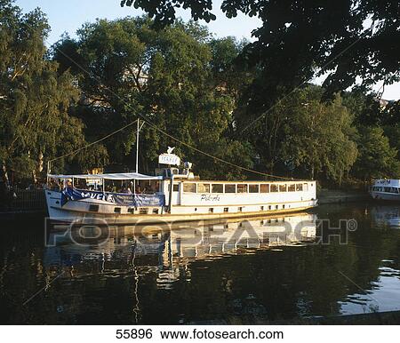 Tour boat in canal, Berlin, Germany View Large Photo Image Stock Photograph - Tour boat in canal, Berlin, Germany . Fotosearch