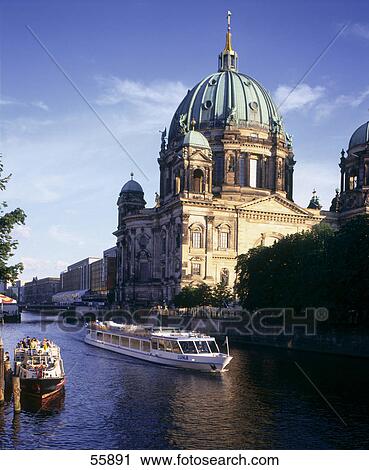 Tour boats in river, Kaiserdom Church, Spree River, Berlin, Germany View Large Photo Image Stock Image - Tour boats in river, Kaiserdom Church, Spree River, Berlin, Germany . Fotosearch