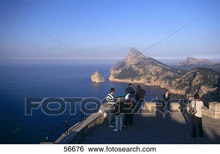 Tourists at an observation point on a coast View Large Photo Image Stock Photograph - Tourists at an observation point on a coast . Fotosearch