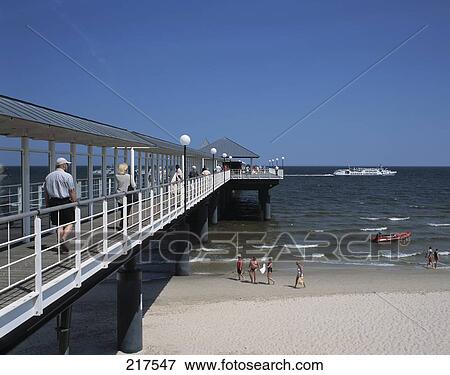 Tourists at covered pier, Mecklenburg-Vorpommern, Germany View Large Photo Image Stock Photo - Tourists at covered pier, Mecklenburg-Vorpommern, Germany . Fotosearch