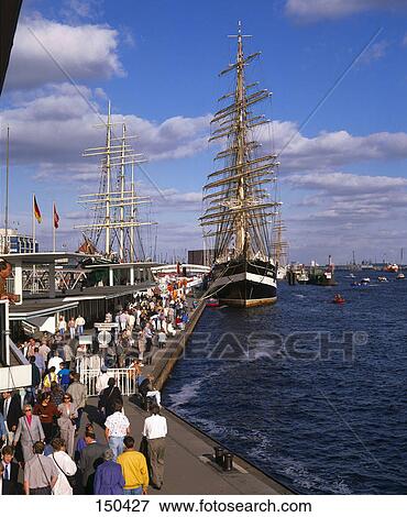Tourists at harbor near ship, Port. St. Pauli, Hamburg, Germany View Large Photo Image Stock Photo - Tourists at harbor near ship, Port. St. Pauli, Hamburg, Germany . Fotosearch