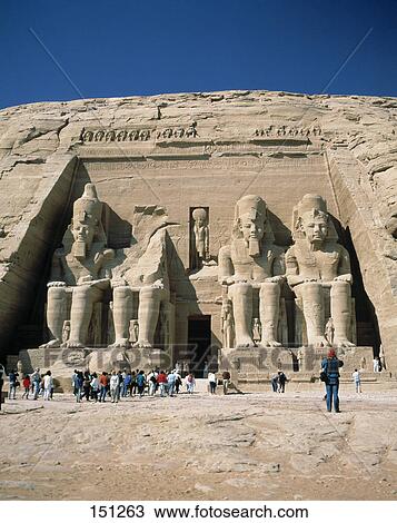 Stock Image - Tourists at old ruins of temple, Temple Of Luxor, Luxor, Egypt . Fotosearch