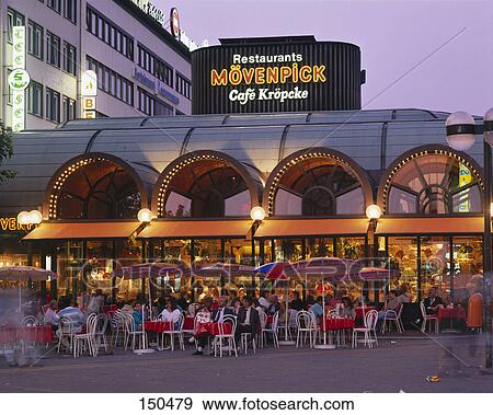 Tourists at outdoor cafe, Hannover, Germany View Large Photo Image Stock Photo - Tourists at outdoor cafe, Hannover, Germany . Fotosearch
