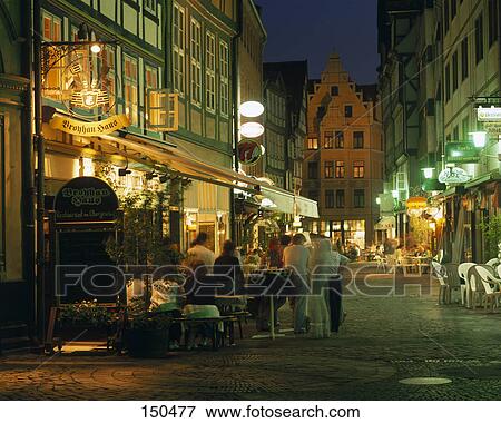 Stock Photo - Tourists at sidewalk cafe in street, Hannover, Germany . Fotosearch
