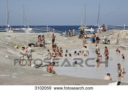 Tourists in a sulfur mud, Porto di Levante, Sicily, Italy View Large Photo Image Stock Photo - Tourists in a sulfur mud, Porto di Levante, Sicily, Italy . Fotosearch
