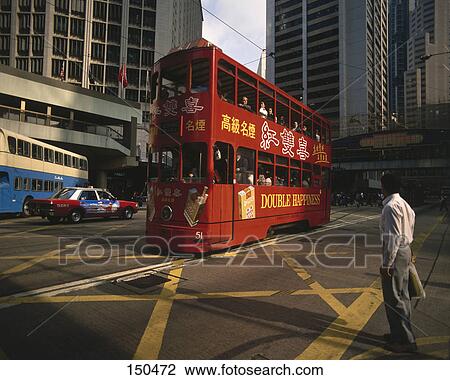 Tourists in double decker bus in city, Hong Kong View Large Photo Image Stock Image - Tourists in double decker bus in city, Hong Kong . Fotosearch