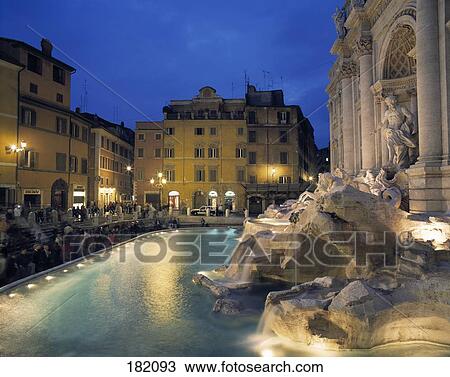Tourists near fountain lit up at dusk, Fontana di Trevi, Rome, Lazio, Italy View Large Photo Image Stock Image - Tourists near fountain lit up at dusk, Fontana di Trevi, Rome, Lazio, Italy . Fotosearch