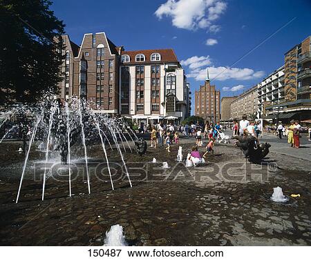 Tourists near water fountain, Brunnen der Lebensfreude, Rostock, Germany View Large Photo Image Stock Photo - Tourists near water fountain, Brunnen der Lebensfreude, Rostock, Germany . Fotosearch