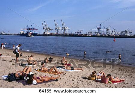 Stock Photography - Tourists on beach, Elbe River, Oevelgoenne, Hamburg, Germany . Fotosearch