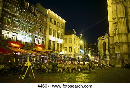 Stock Photo - Tourists sitting at outdoor restaurant, Antwerp, Belgium . Fotosearch