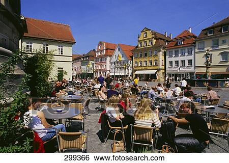 Tourists sitting at sidewalk cafe, Swabian Jura, Baden-Wurttemberg, Germany View Large Photo Image Stock Photograph - Tourists sitting at sidewalk cafe, Swabian Jura, Baden-Wurttemberg, Germany . Fotosearch