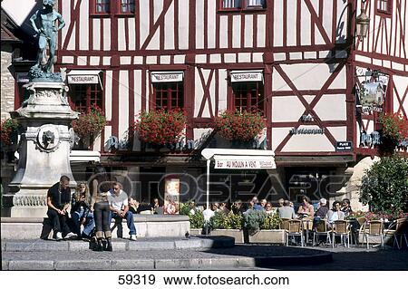 Tourists sitting in front of fountain, Dijon, Burgundy, France View Large Photo Image Stock Photo - Tourists sitting in front of fountain, Dijon, Burgundy, France . Fotosearch