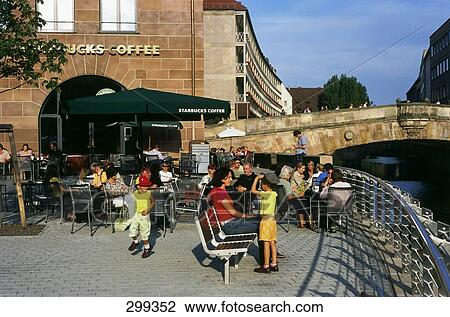Tourists sitting near railing, Pegnitz River, Nuremberg, Bavaria, Germany View Large Photo Image Stock Image - Tourists sitting near railing, Pegnitz River, Nuremberg, Bavaria, Germany . Fotosearch