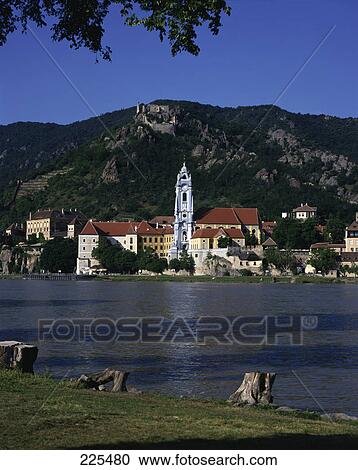 Town at waterfront with castle on hill in background, Duernstein Castle, Austria View Large Photo Image Stock Image - Town at waterfront with castle on hill in background, Duernstein Castle, Austria . Fotosearch