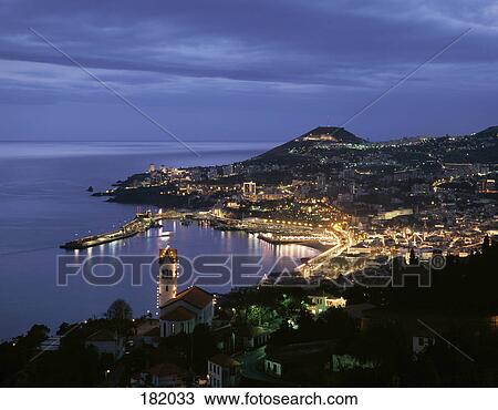 Town lit up at coast during, Funchal, Madeira Island, Portugal View Large Photo Image Stock Image - Town lit up at coast during, Funchal, Madeira Island, Portugal . Fotosearch