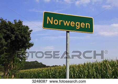 Town sign at a country road, Norwegen, Lastrup, Germany. low angle view  View Large Photo Image Stock Photo - Town sign at a country road, Norwegen, Lastrup, Germany. low angle view . Fotosearch