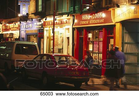 Stock Image - Traffic on road at night, Quarter Soho, China Town, London, England . Fotosearch