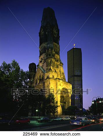 Stock Photo - Traffic on road besides old ruins of church, Emperor William Memorial Church, Berlin, Germany . Fotosearch