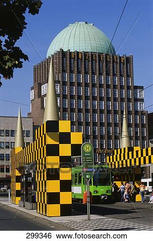 Tram on road in front of building, Anzeiger-Hochhaus, Hannover, Germany View Large Photo Image Stock Photograph - Tram on road in front of building, Anzeiger-Hochhaus, Hannover, Germany . Fotosearch