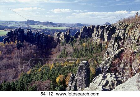 Stock Image - Trees on mountains, Mt Schrammsteine, Saxony, Germany . Fotosearch