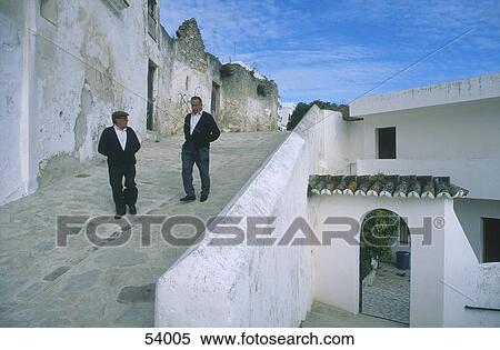 Stock Photography - Two men at white houses, Vejer de la Frontera, Andalusia, Spain . Fotosearch