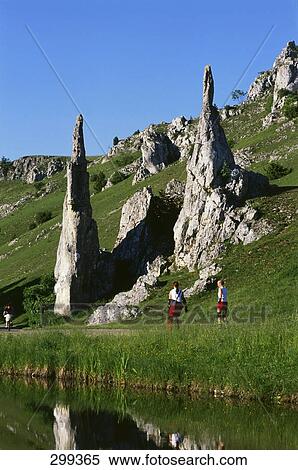 Stock Photography - Two people walking along river, Eselsburger Tal, Baden-Wurttemberg, Germany . Fotosearch
