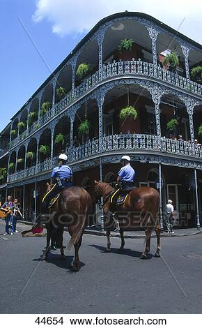 Picture - Two policemen riding horses on road, French Quarter, Bourbon Street, New Orleans, Louisiana, USA . Fotosearch