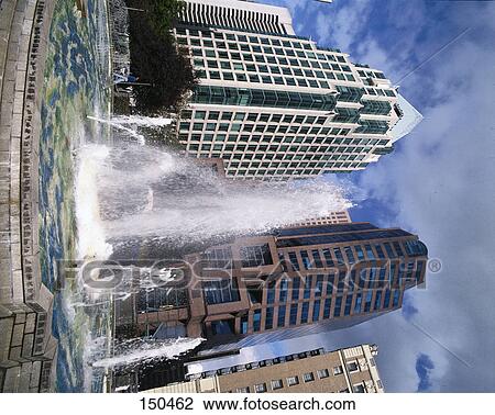 Stock Image - Water fountain in front of buildings, Vancouver, British Columbia, Canada . Fotosearch